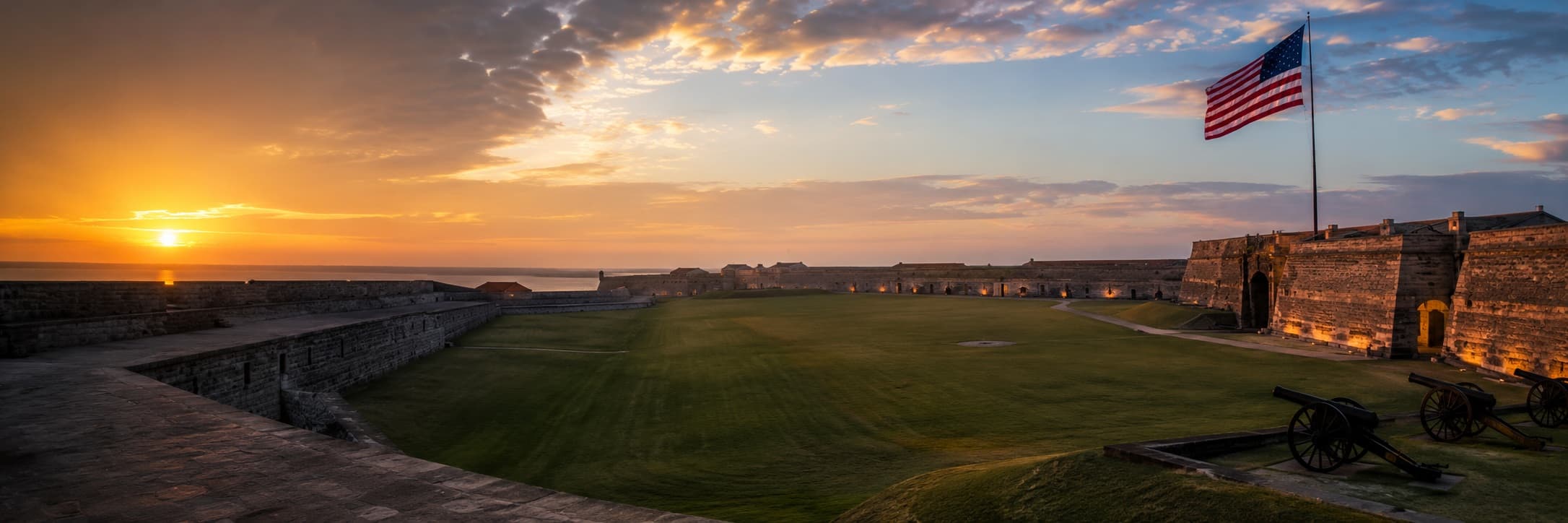 U.S. Army parade ground at sunrise with American flag