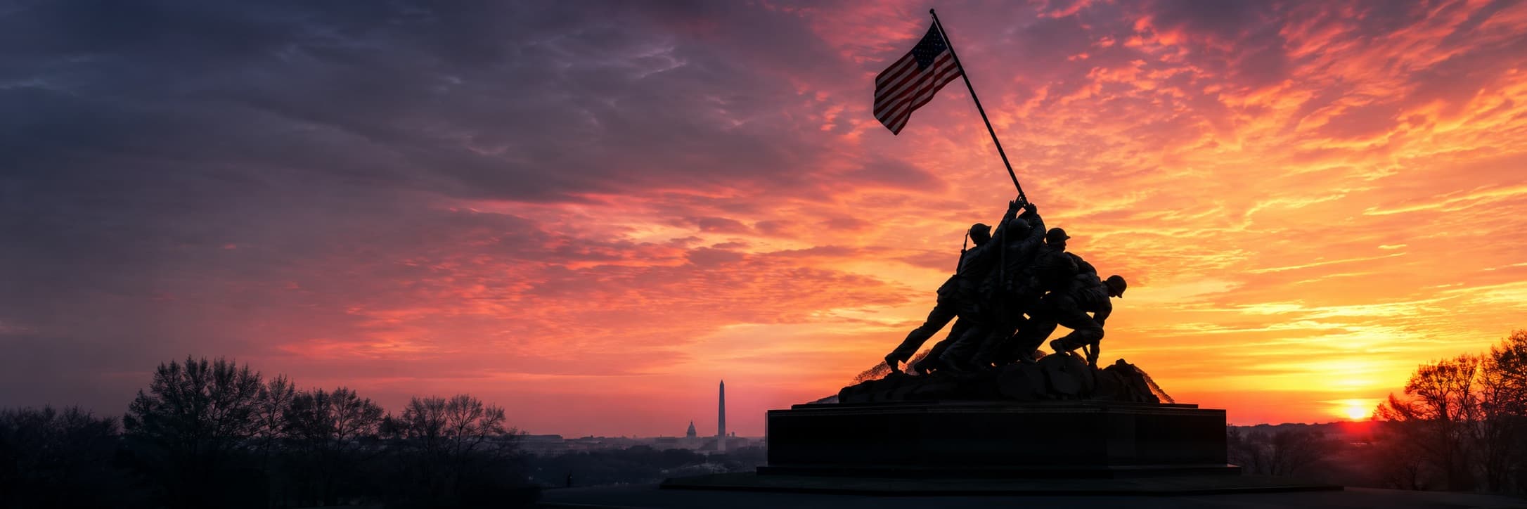 U.S. Marine Corps War Memorial silhouetted against sunrise sky